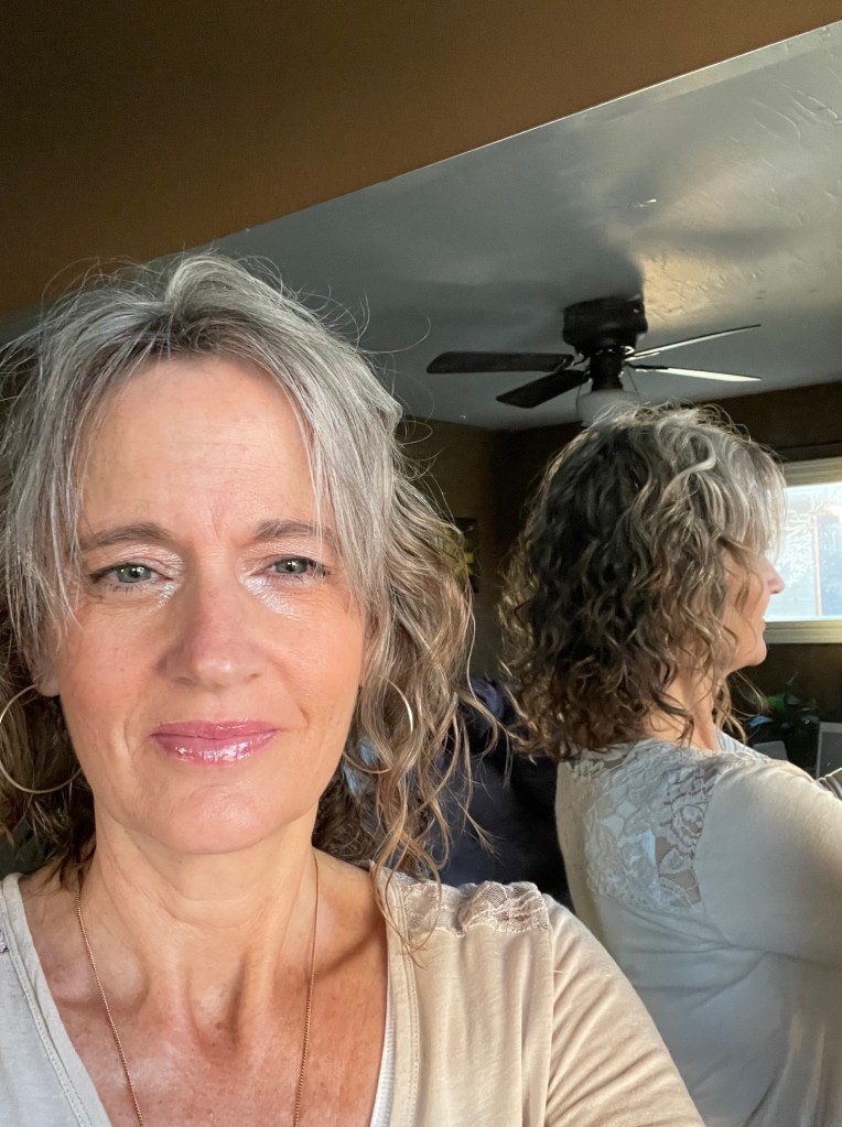 Here is me with half colored half gray hair. I cut it pretty short to help the transition along quicker.